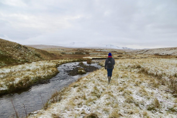 Gethin walking along a snowy riverbank Gethin walking along a snowy riverbank